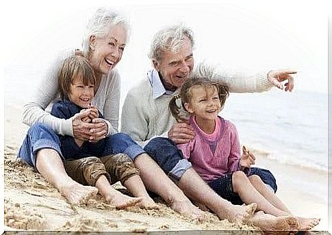 Grandparents with grandchildren on the beach