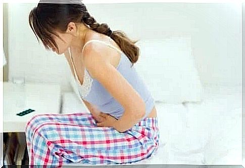 Woman with severe stomach pain