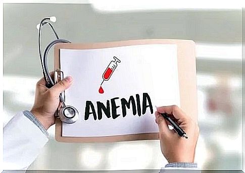 Doctor drawing the word anemia on a board