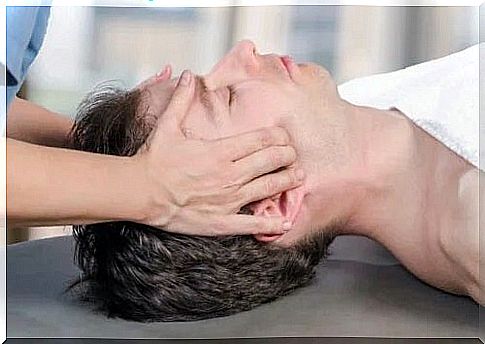 Physiotherapist treating the causes of temporomandibular dislocation