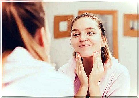 Woman cleaning her face