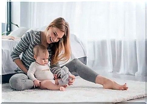 Mother with her baby on the floor