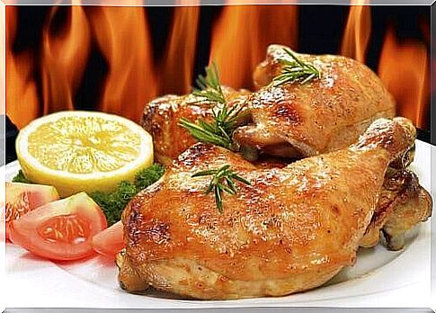 Baked chicken with oranges and rosemary served on a plate