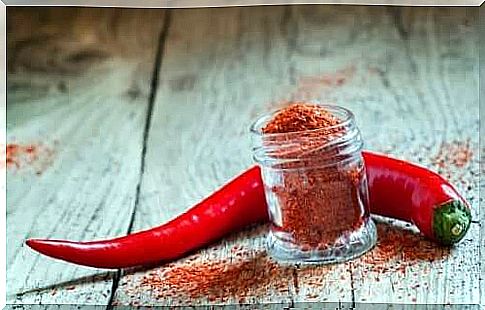 Cayenne pepper next to a jar of pepper