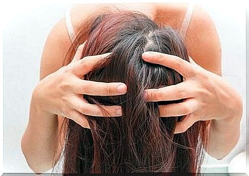 Girl applying rosemary hair treatments