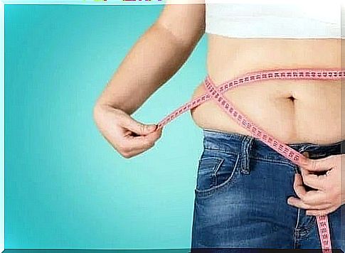 Woman measuring her waist