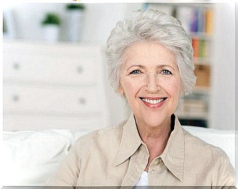 Woman with white hair smiling